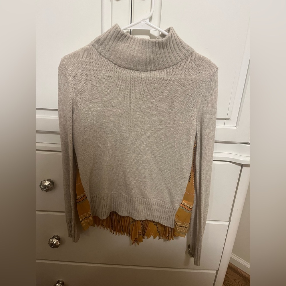 Anthropologie sweater. Beige and fun accordion print on the back